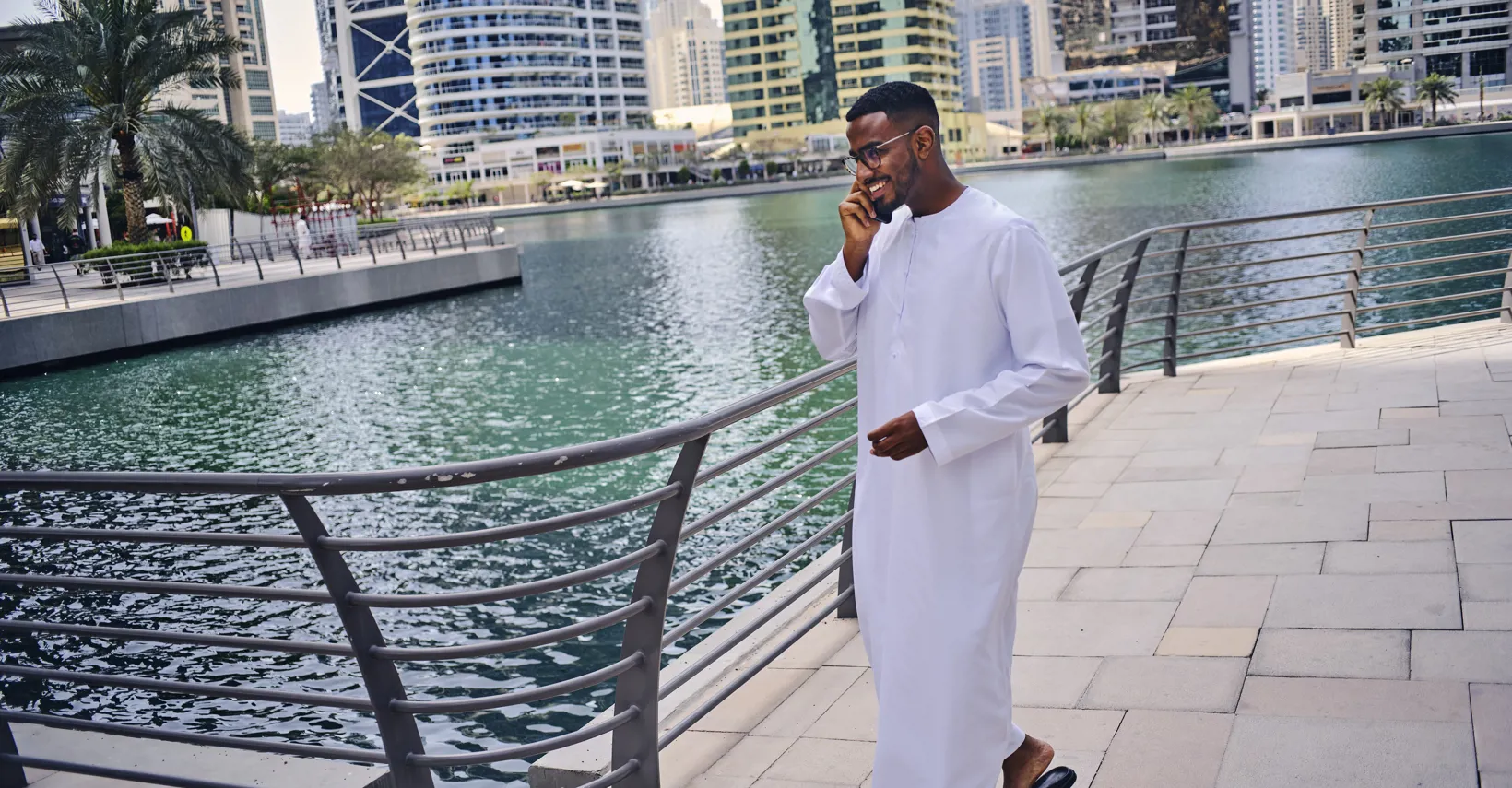 man smiling on the phone in Dubai