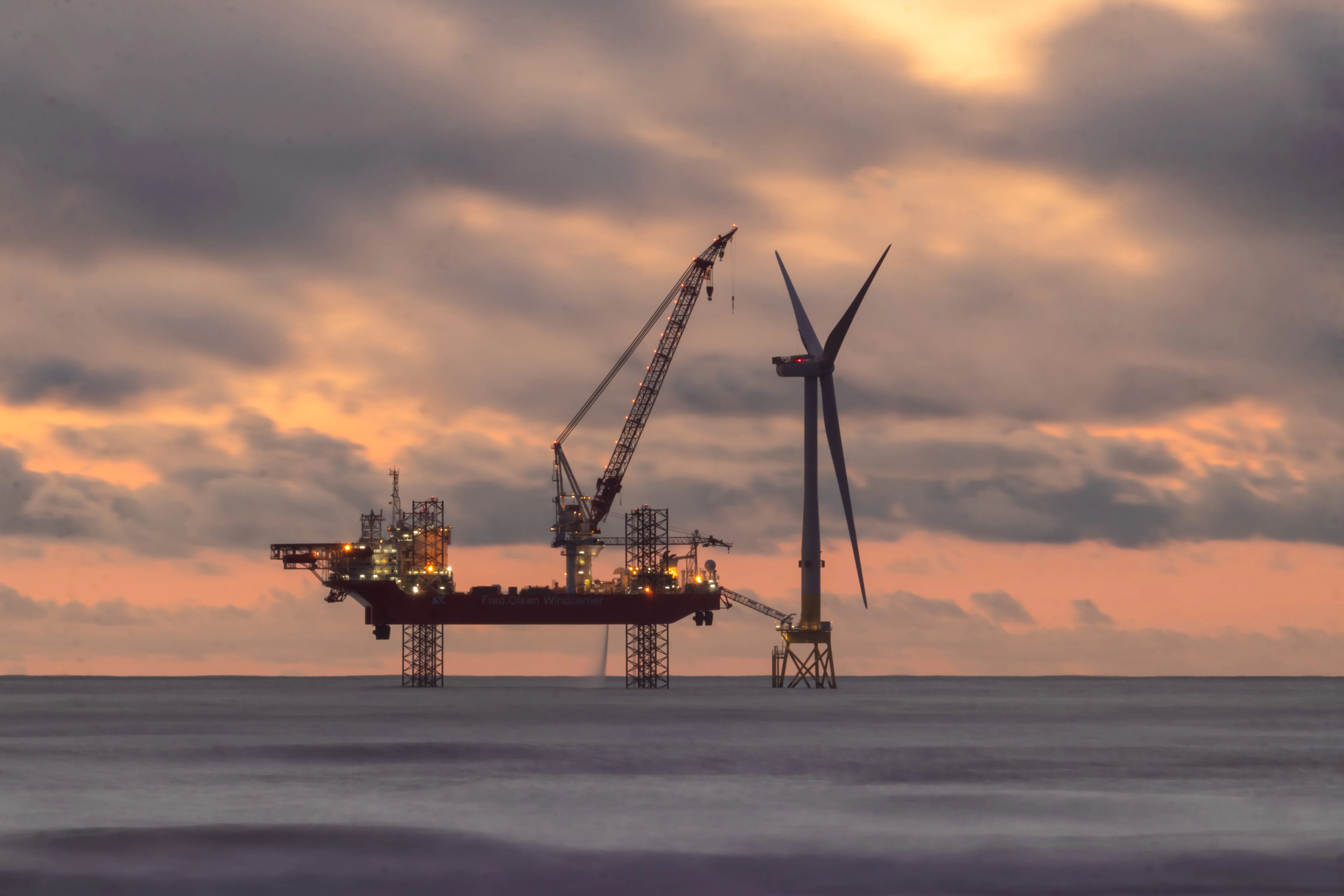 wind turbine instillation undertaking maintenance at an offshore wind farm location