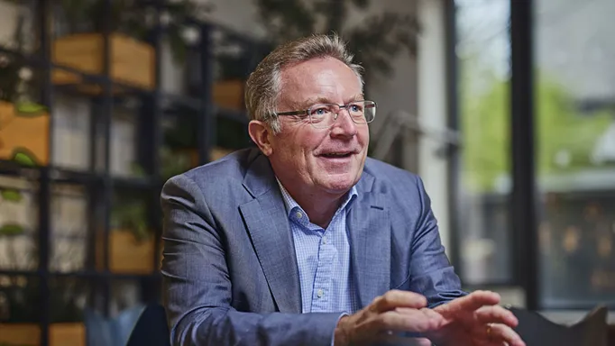 man sitting at a table talking