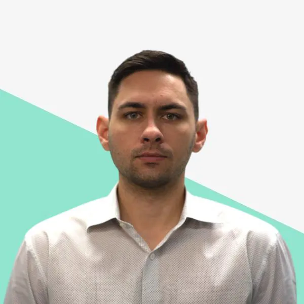 Man with short hair in a collared shirt.