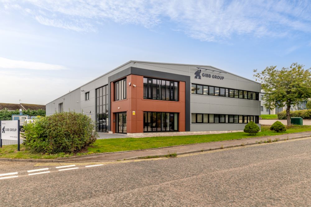 Modern gray building with Gibb Group signage.