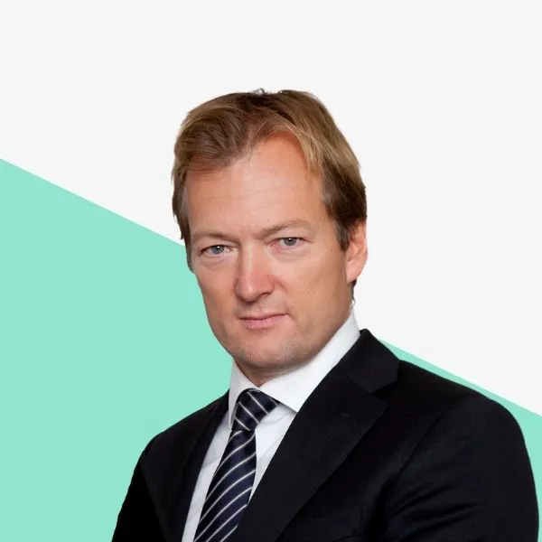 Man in a suit with a serious expression.