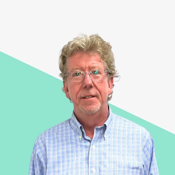 Middle-aged man with glasses in a checkered shirt.