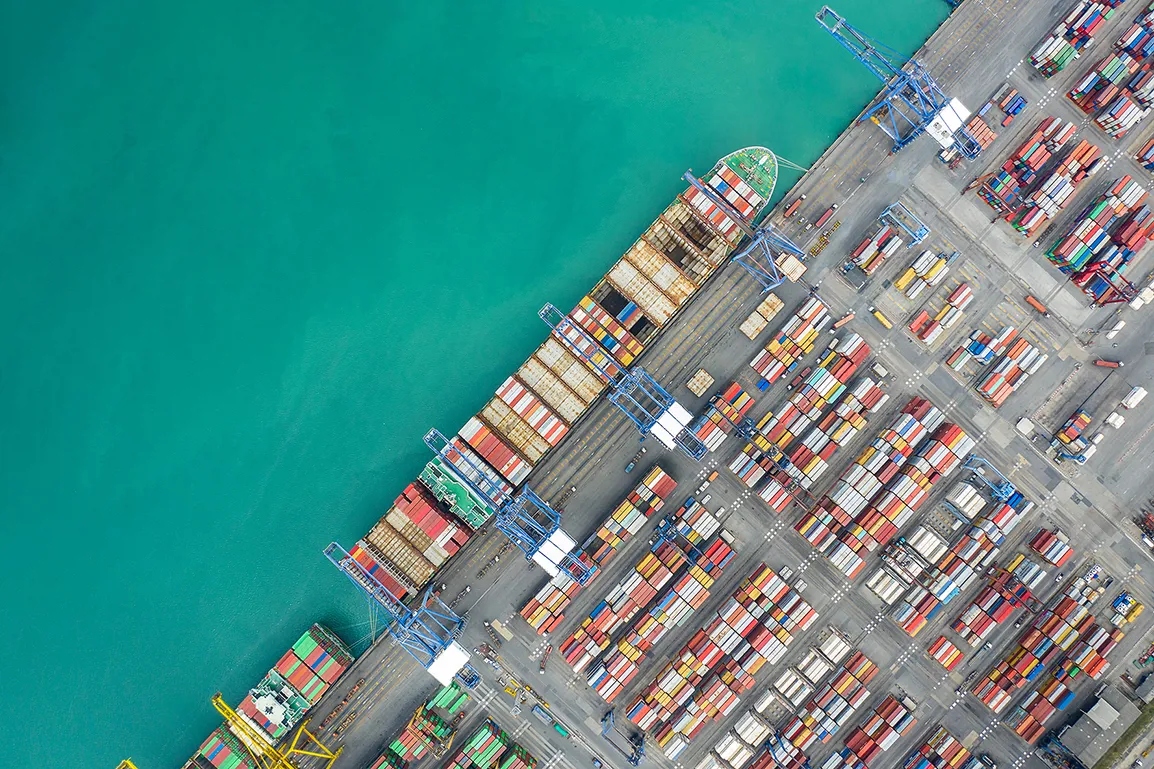 Aerial top view container cargo ship working. Business import export logistic and transportation of International by ship in the open sea.