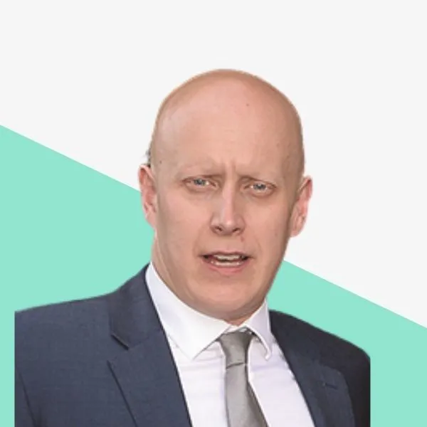 A man in a suit with a serious expression.