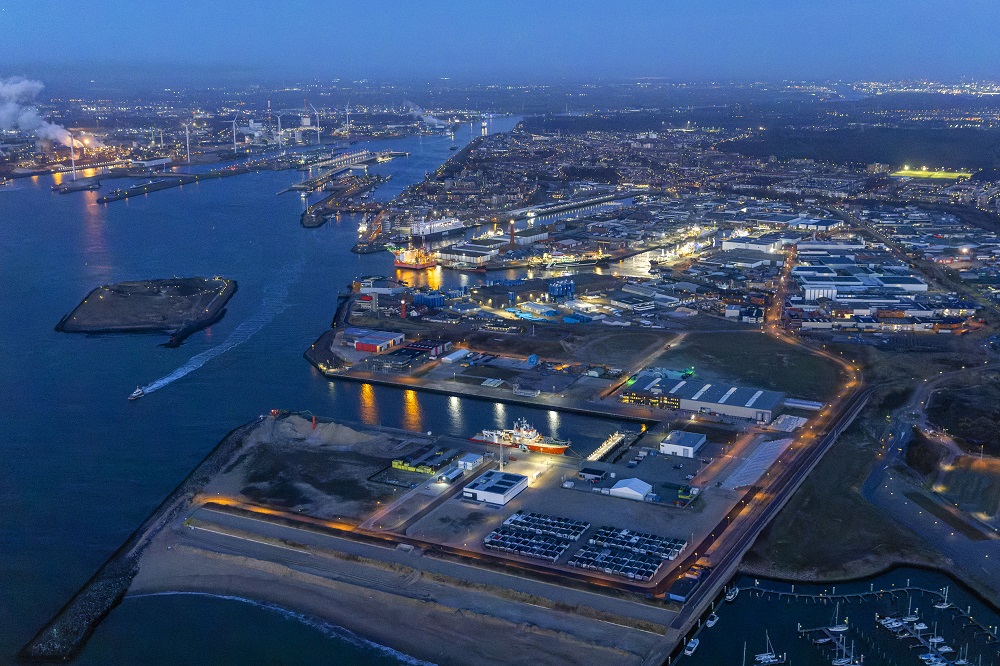 Aerial view of a harbor with ships and warehouses.