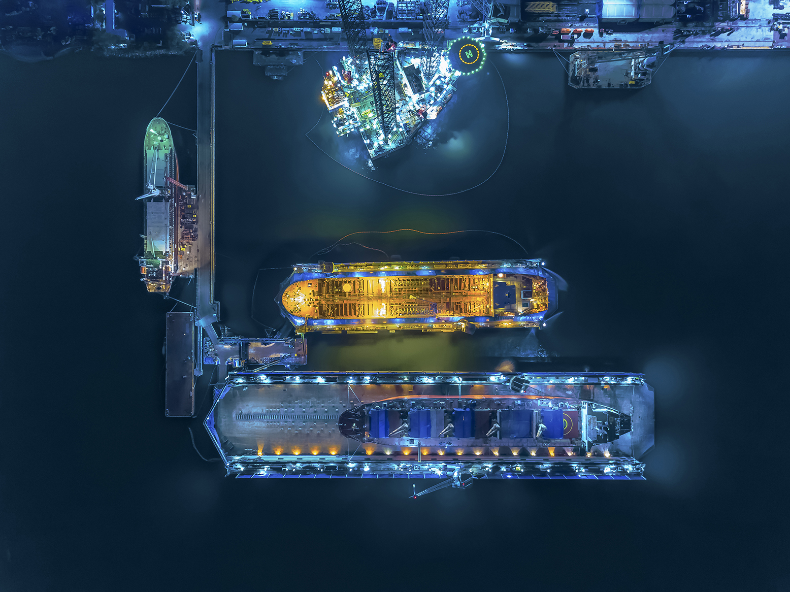aerial view shipyard have crane machine and container ship in green sea