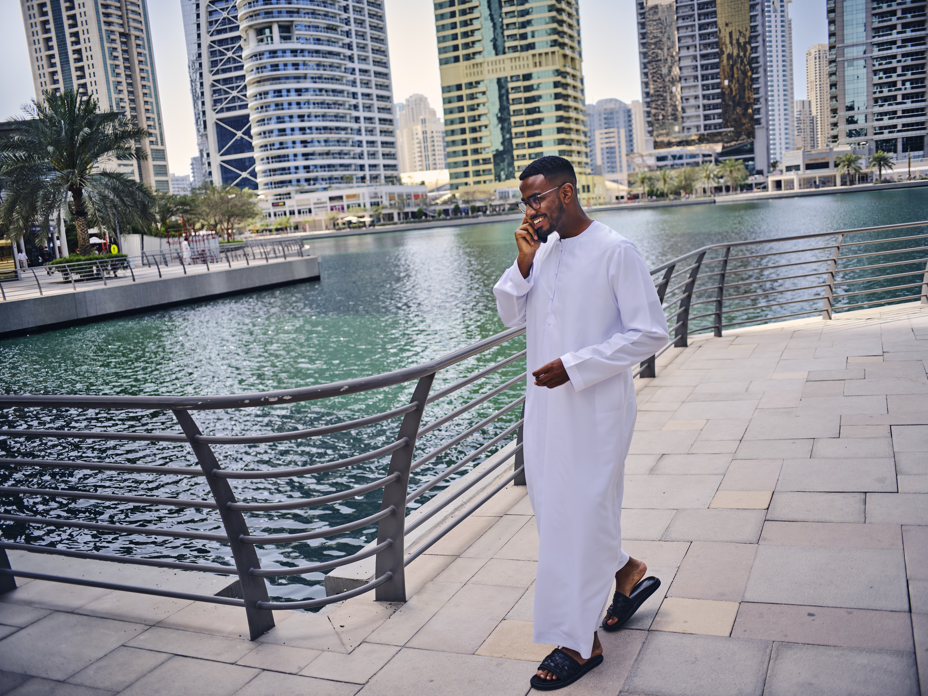 man smiling on the phone in Dubai