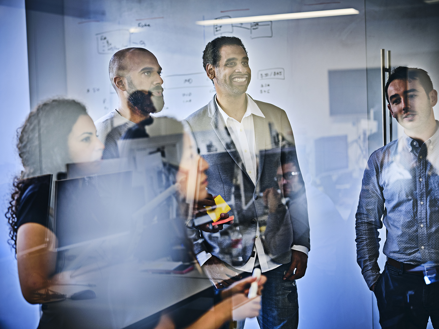 Colleagues in a meeting discussing new ideas