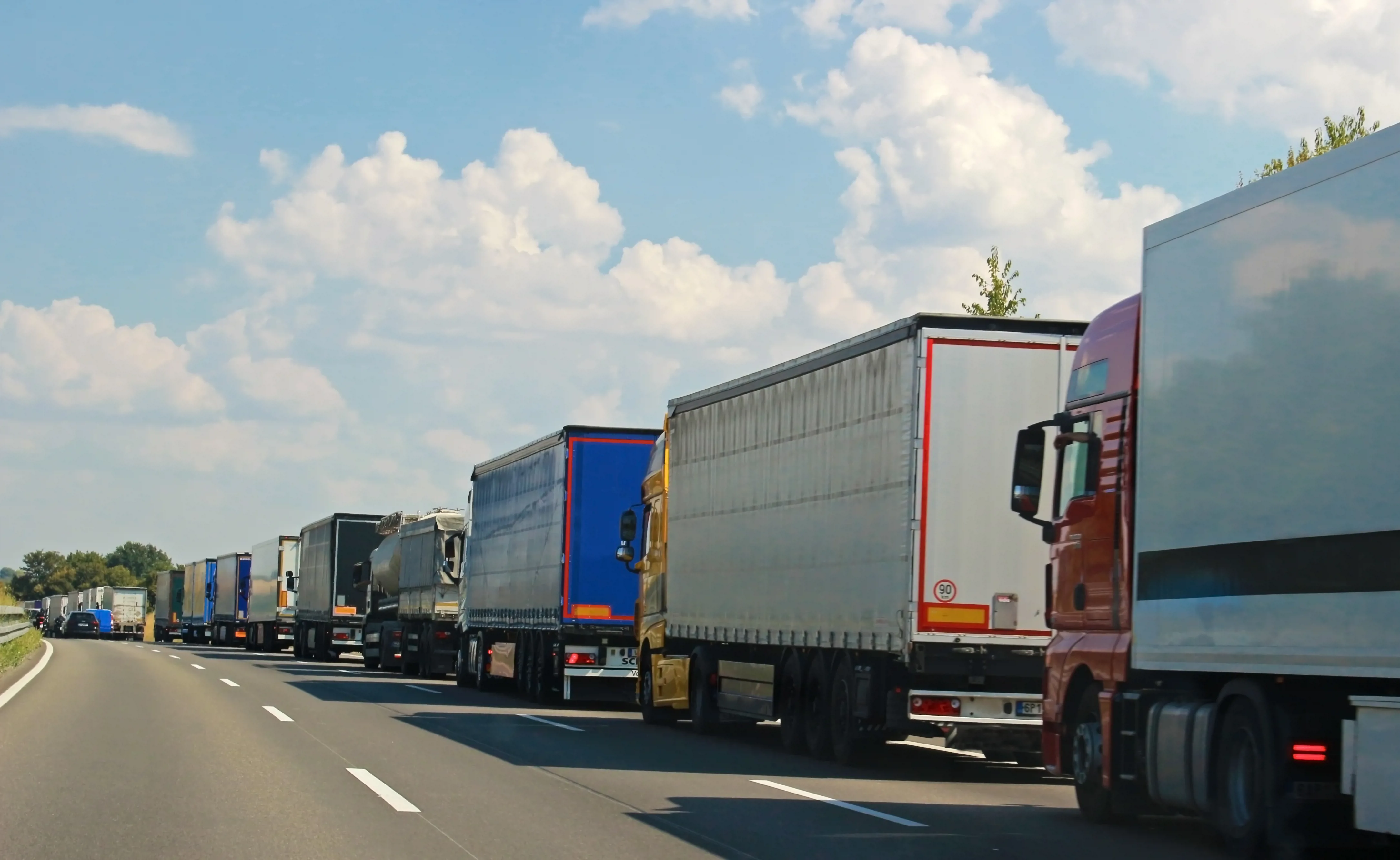 long row of trucks on a German highway