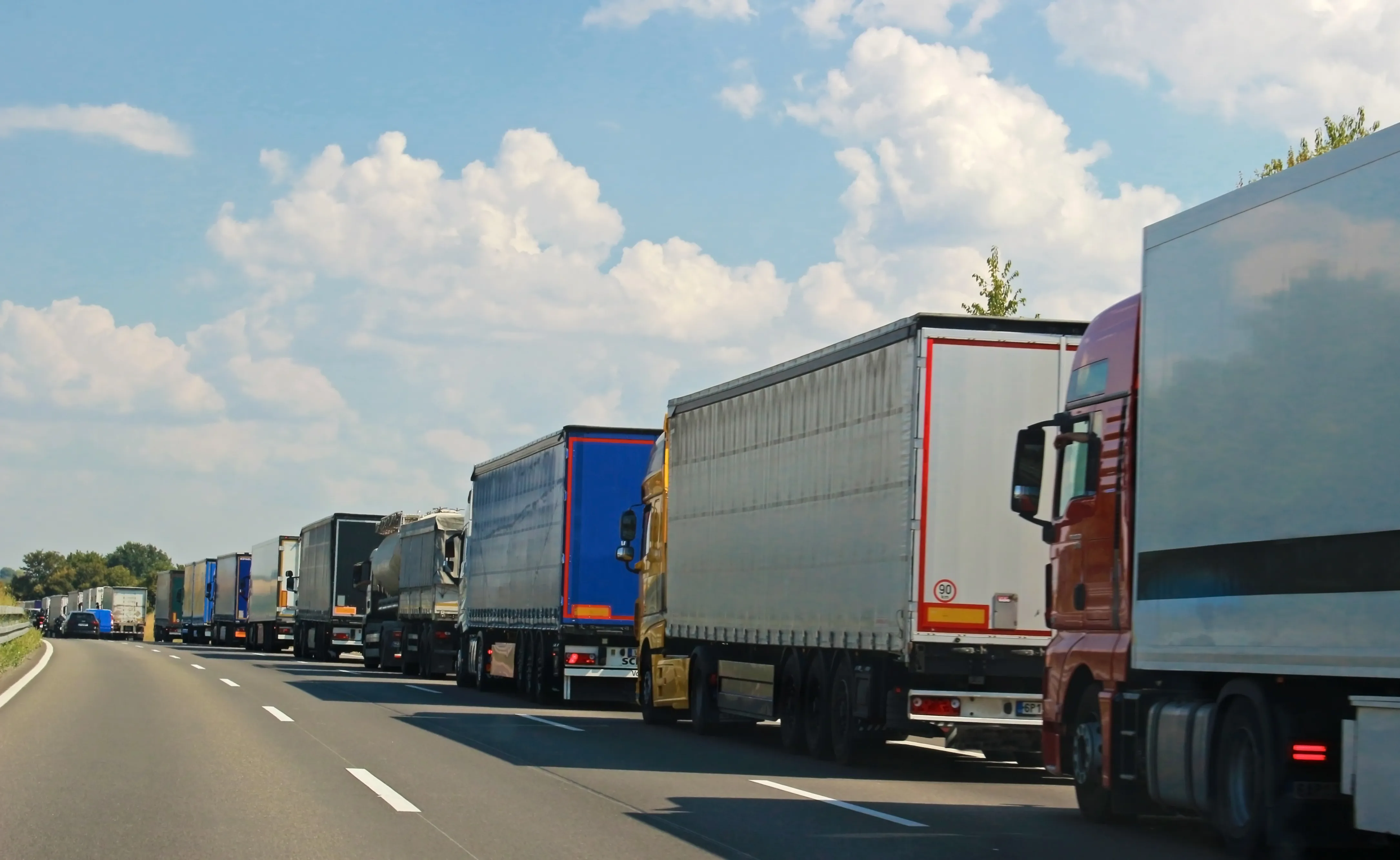 long row of trucks on a German highway